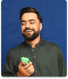 Khalis brand ambassador holding a pack of Khalis milk