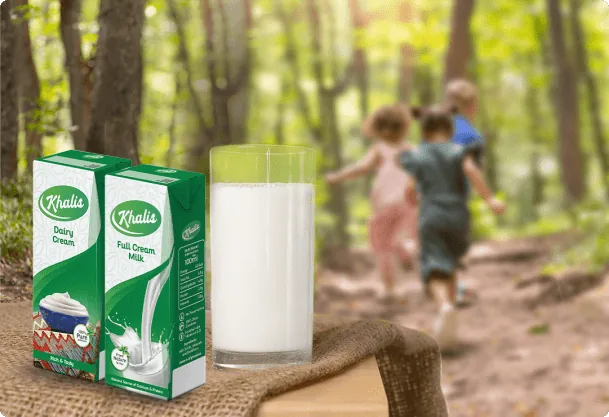 Khalis milk packs on a table in a forest